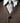 Gray knitted necktie and brown button-up vest