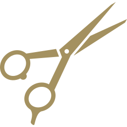 Gold scissors on a white background